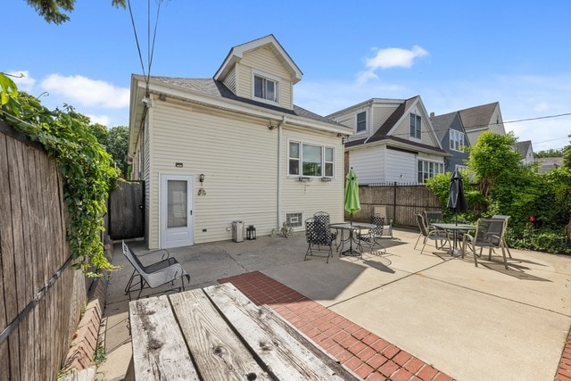 rear view of property featuring a patio