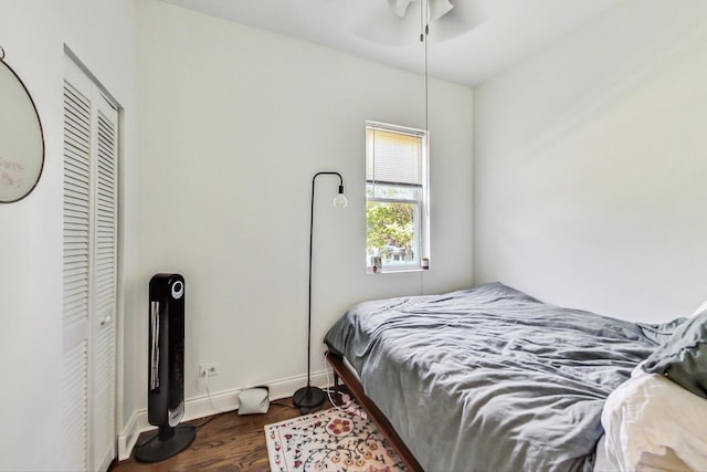 bedroom featuring ceiling fan and dark hardwood / wood-style flooring