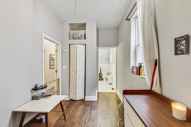 entryway with dark hardwood / wood-style floors