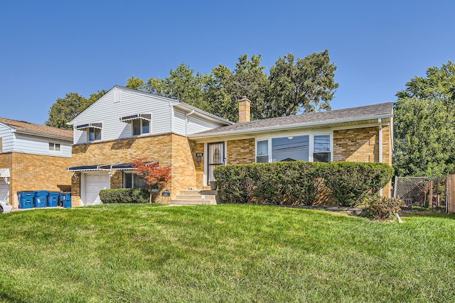 split level home featuring a garage and a front yard