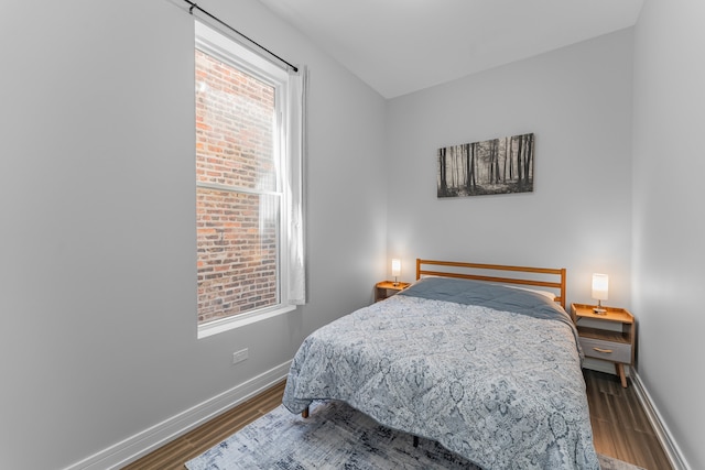 bedroom with hardwood / wood-style flooring