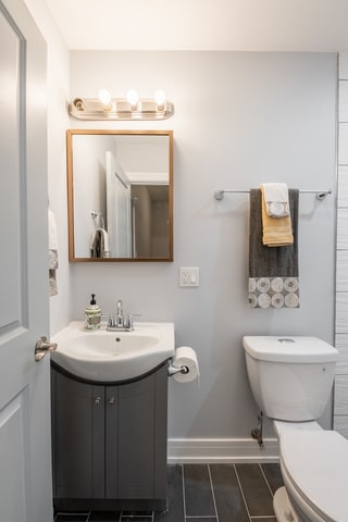 bathroom featuring vanity and toilet