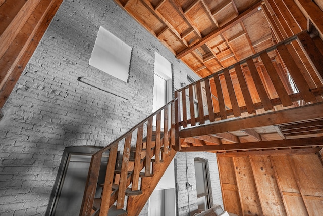 staircase with brick wall