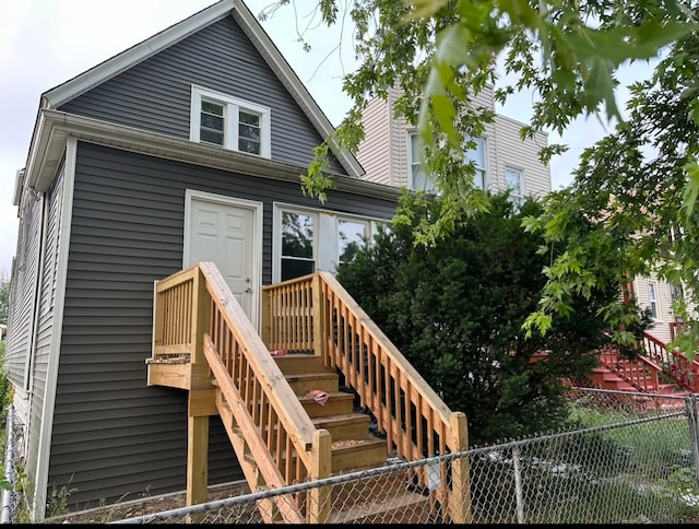 back of property featuring a wooden deck