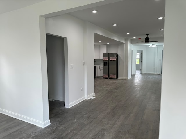 corridor featuring dark hardwood / wood-style flooring