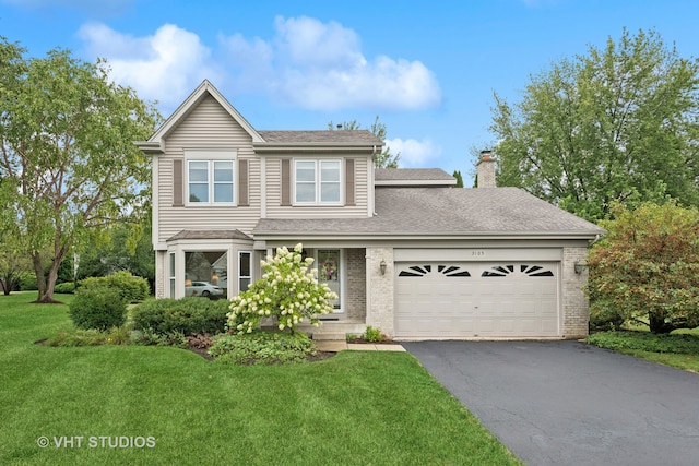 view of front facade featuring a front lawn and a garage