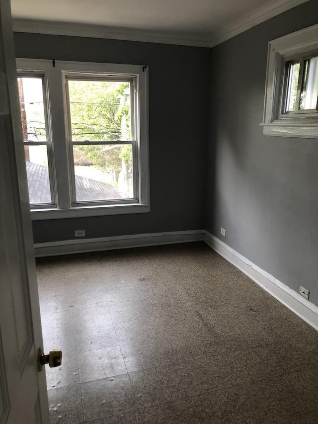 1813 Dempster St, Evanston, IL 60201 - empty room with crown molding and baseboards