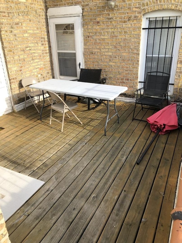 1813 Dempster St, Evanston, IL 60201 - wooden terrace with outdoor dining area