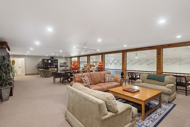 living room featuring ceiling fan and light colored carpet