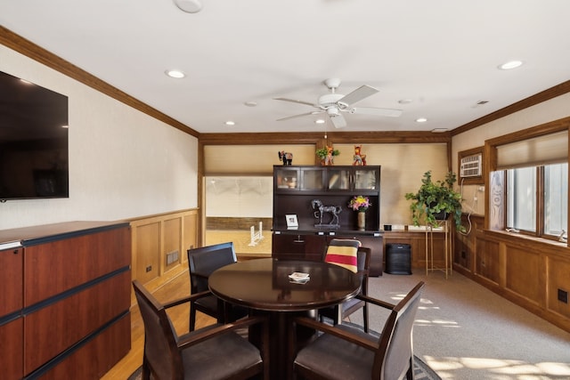 carpeted dining area featuring ornamental molding and ceiling fan