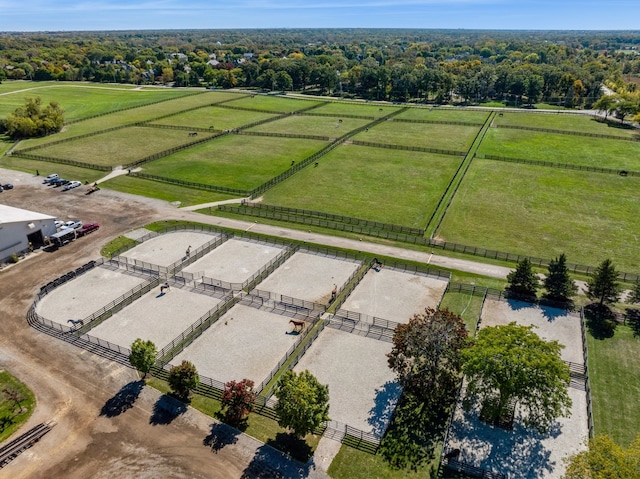 birds eye view of property with a rural view