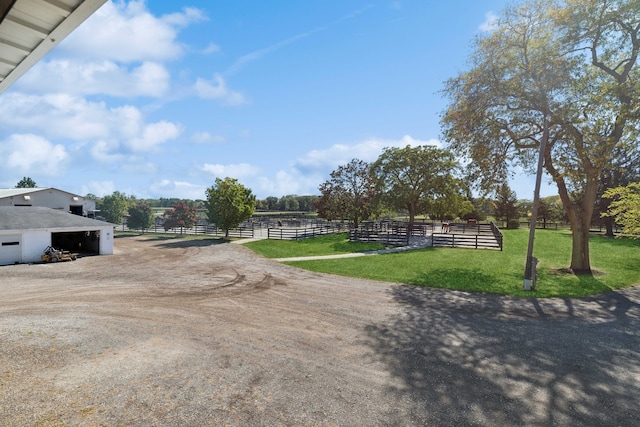 view of yard with a rural view