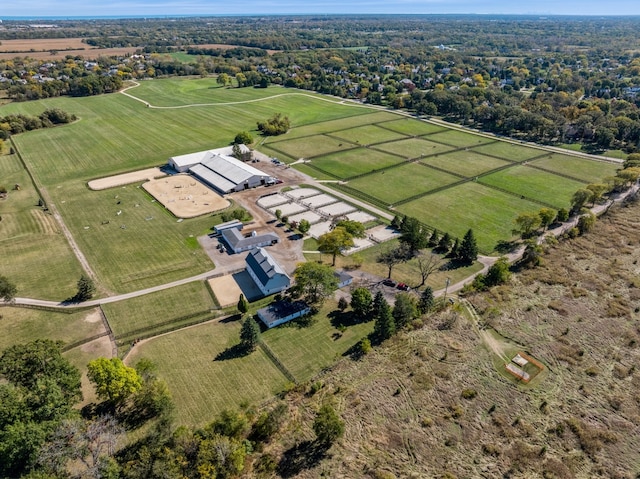 birds eye view of property with a rural view