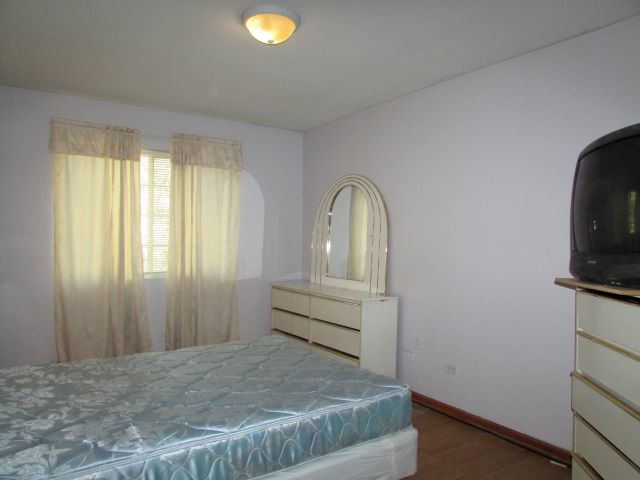 bedroom featuring hardwood / wood-style flooring