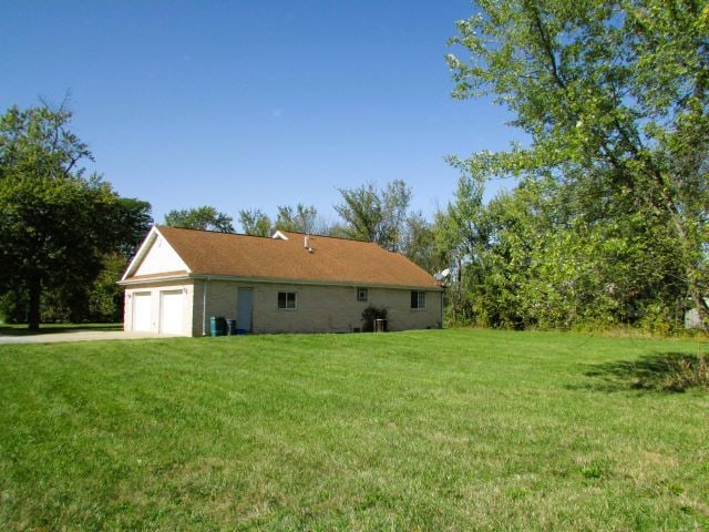 view of yard featuring a garage