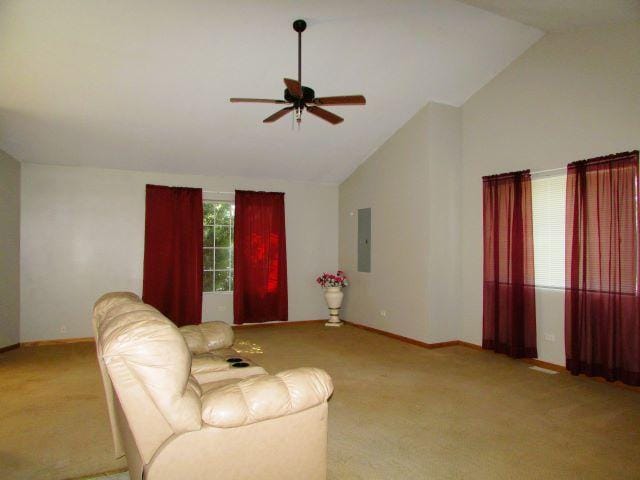 living area with electric panel, baseboards, carpet, a ceiling fan, and high vaulted ceiling