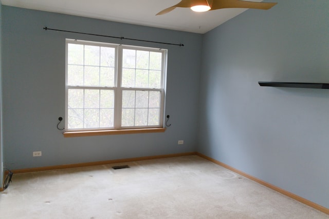 unfurnished room with carpet flooring and ceiling fan