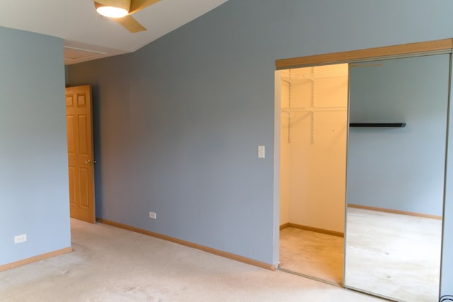 unfurnished bedroom with carpet flooring, a closet, and ceiling fan