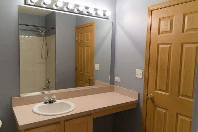 bathroom featuring vanity and shower / washtub combination