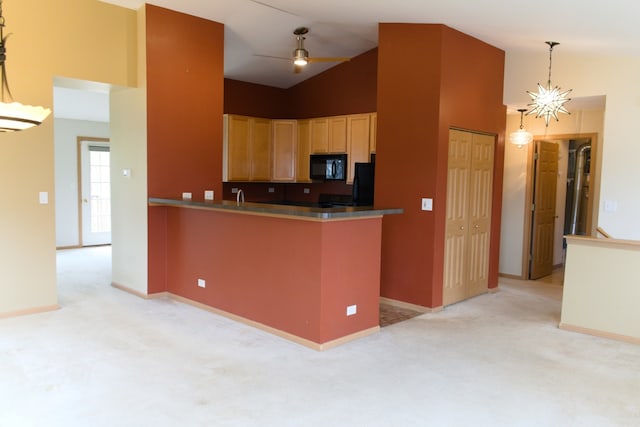 kitchen with light brown cabinets, high vaulted ceiling, decorative light fixtures, light colored carpet, and kitchen peninsula