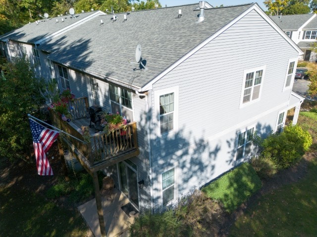 back of property featuring a balcony