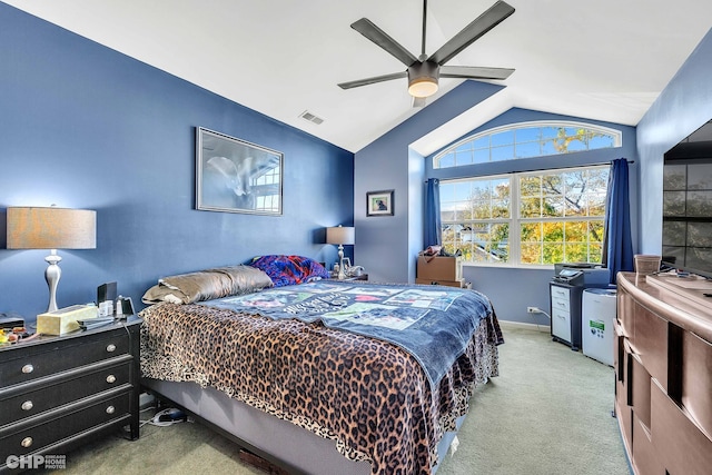 bedroom with lofted ceiling, light carpet, and ceiling fan