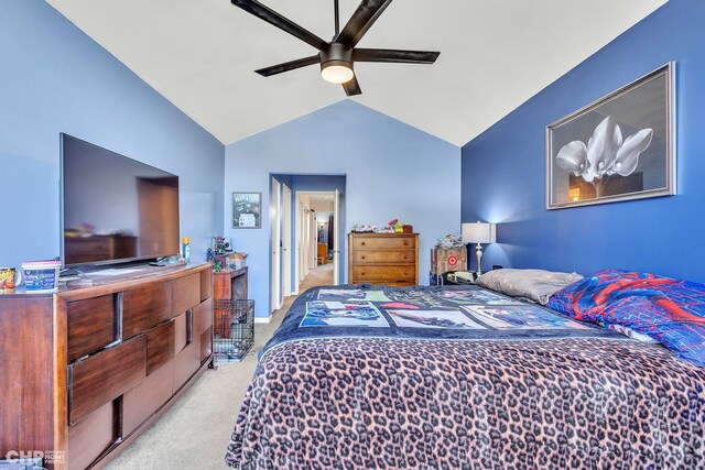 bedroom featuring ceiling fan, lofted ceiling, and light colored carpet