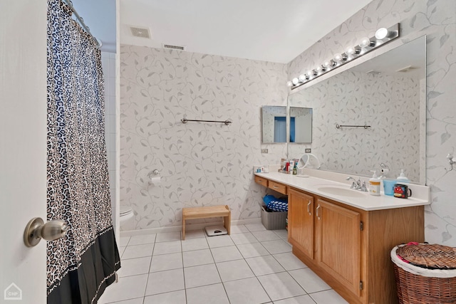 bathroom featuring vanity, toilet, tile patterned floors, and a shower with shower curtain