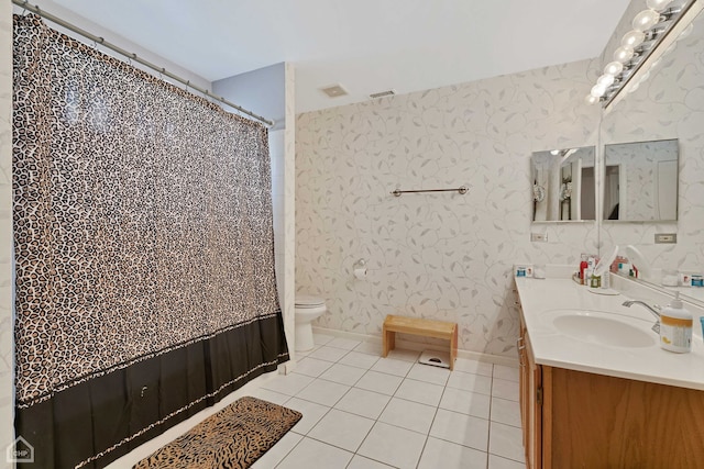 bathroom featuring vanity, toilet, and tile patterned floors