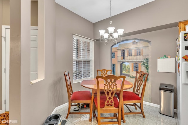 dining space featuring a chandelier and plenty of natural light