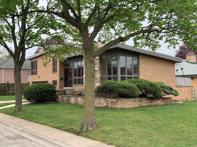 view of home's exterior featuring a lawn