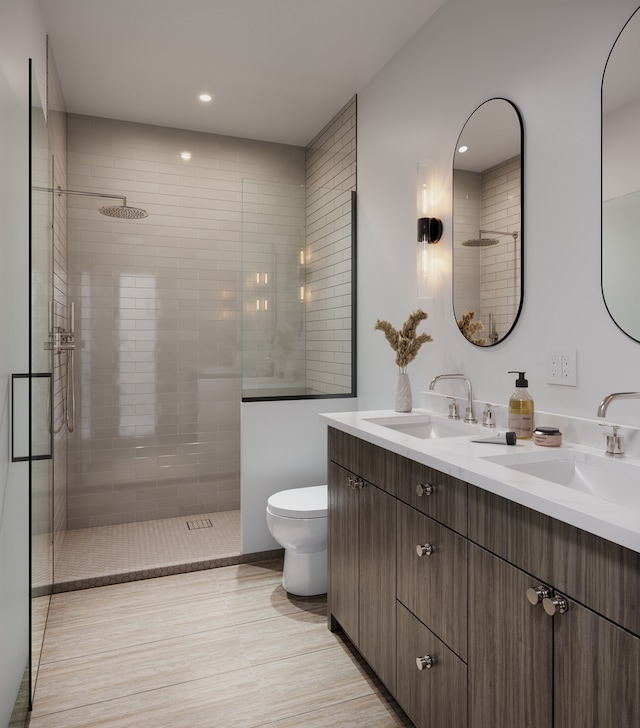 bathroom featuring walk in shower, vanity, and toilet