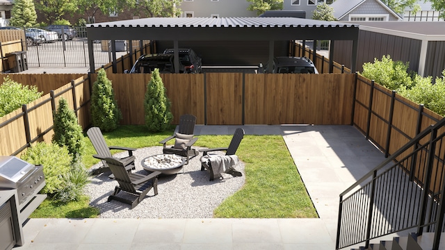 view of yard with a patio and an outdoor fire pit