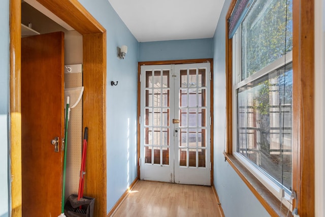 entryway featuring french doors and light hardwood / wood-style floors