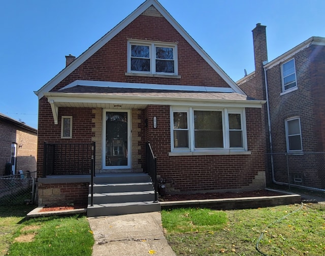 bungalow with a front yard