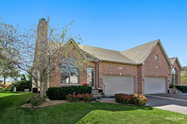 view of front facade featuring central AC unit, a garage, and a front lawn