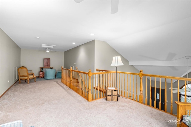 interior space with light carpet and vaulted ceiling