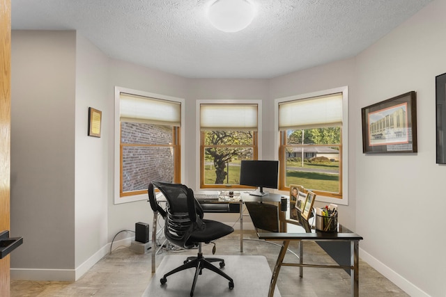 office area featuring a textured ceiling