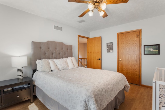 bedroom featuring ceiling fan and light wood-type flooring