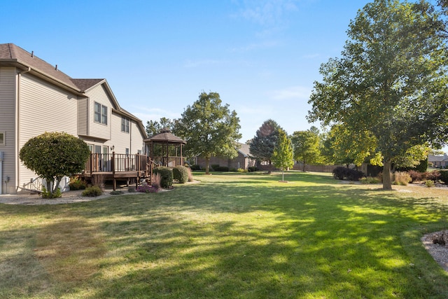 view of yard featuring a gazebo and a deck