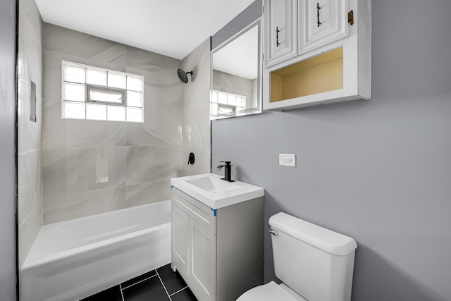 full bathroom with vanity, tile patterned flooring, toilet, and  shower combination