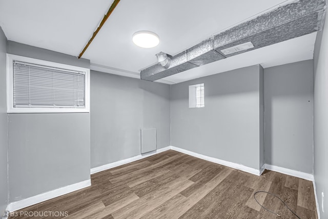 basement featuring hardwood / wood-style floors