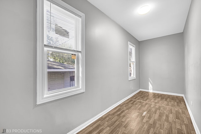 empty room featuring hardwood / wood-style flooring