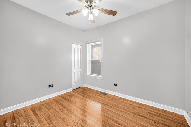 spare room featuring ceiling fan and wood-type flooring