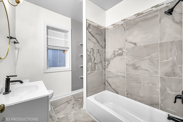 full bathroom featuring toilet, vanity, and tiled shower / bath combo