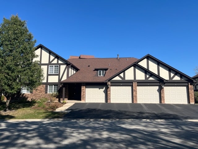 tudor home with a garage