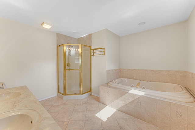 bathroom with independent shower and bath, vanity, and tile patterned flooring