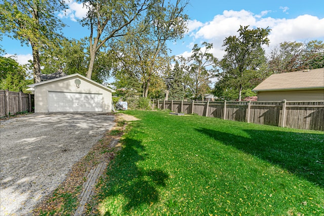 view of yard with an outdoor structure and a garage