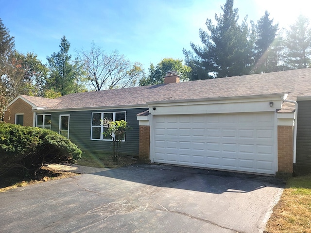 single story home featuring a garage