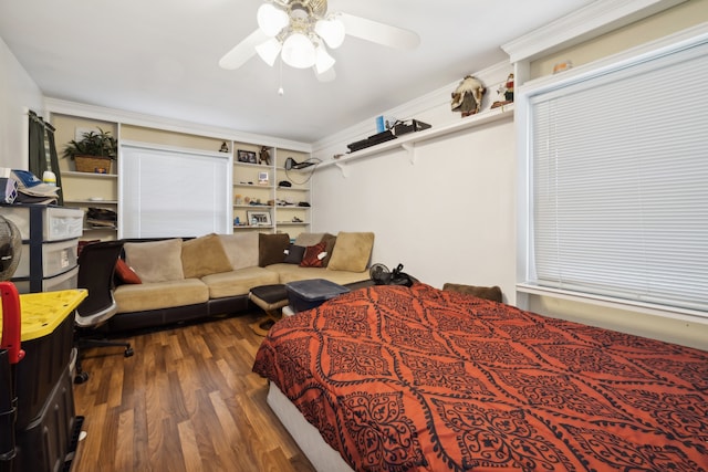 bedroom featuring ceiling fan and dark hardwood / wood-style floors